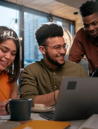 People collaborating around a laptop